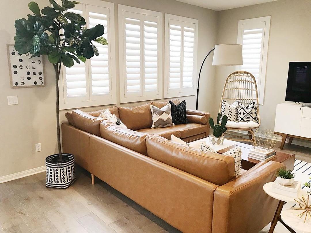 Warm living room with Polywood shutters in Cincinnati.